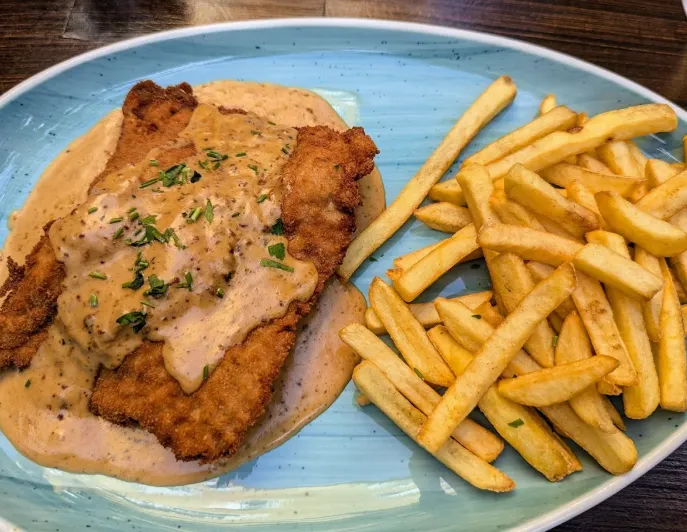 Schnitzel dish with fries